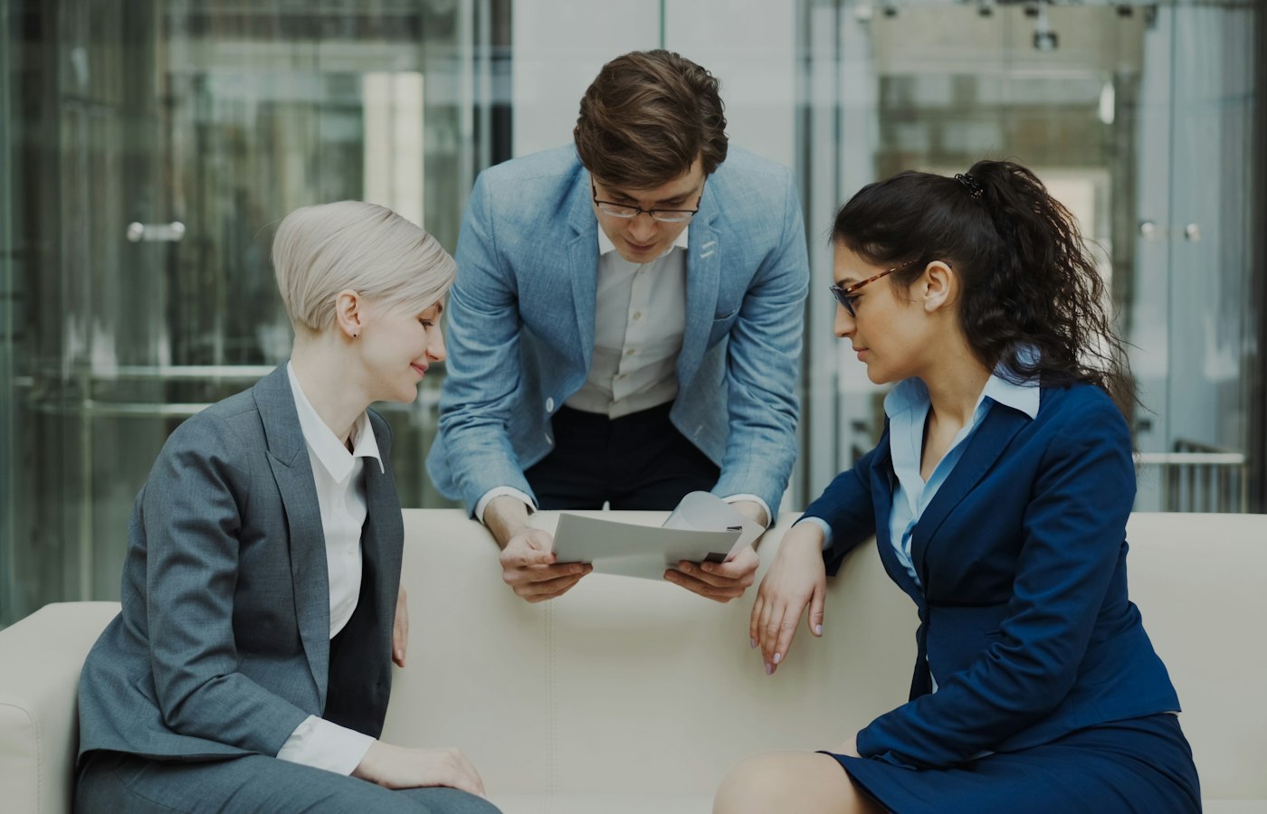 Colleagues reviewing a cost report together in an office